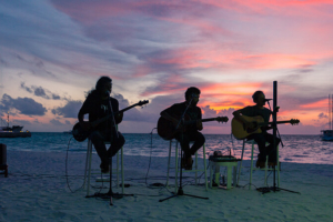 Musicians performing at the beach in the Maldives | Photo: Meeru Island Resort and Spa